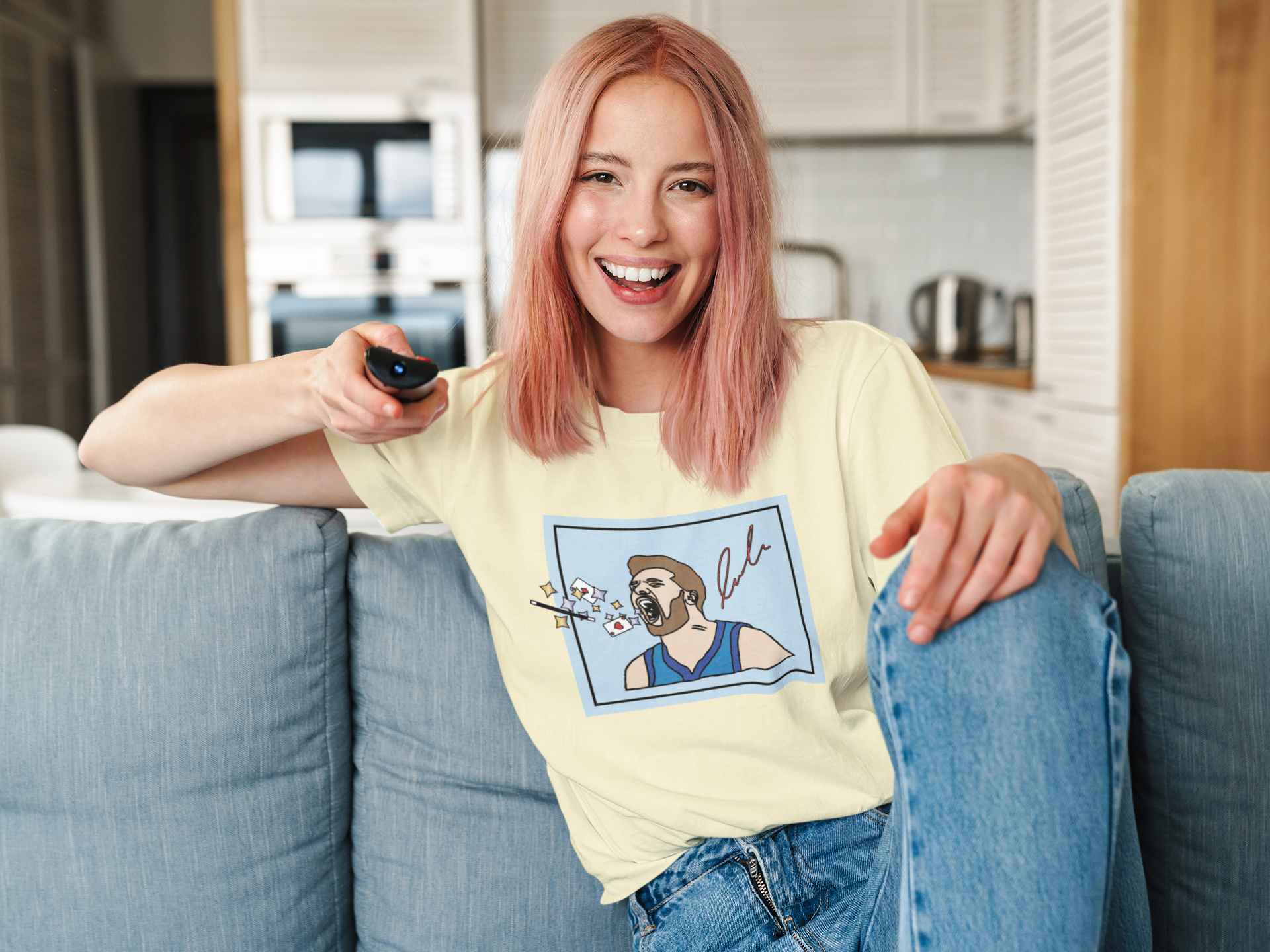 mockup-of-a-woman-with-a-unisex-t-shirt-holding-a-tv-remote-41274-r-el2